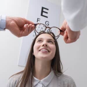 Women getting glasses after comprehensive eye exam