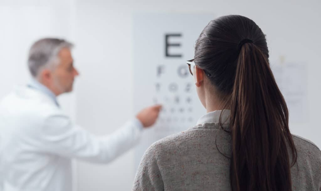 Female patient taking an eye exam